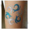 Tatouage paillette turquoise et argent tribal