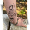 Tatouage montagne soleil